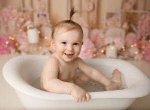 baby is all smiles in the bathtub!