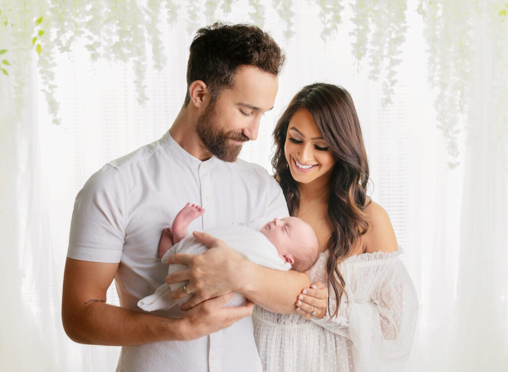 Newborn photography with parents family poses