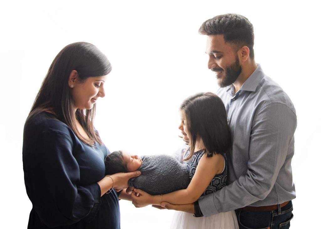 Newborn photography with parents and older sibling family poses
